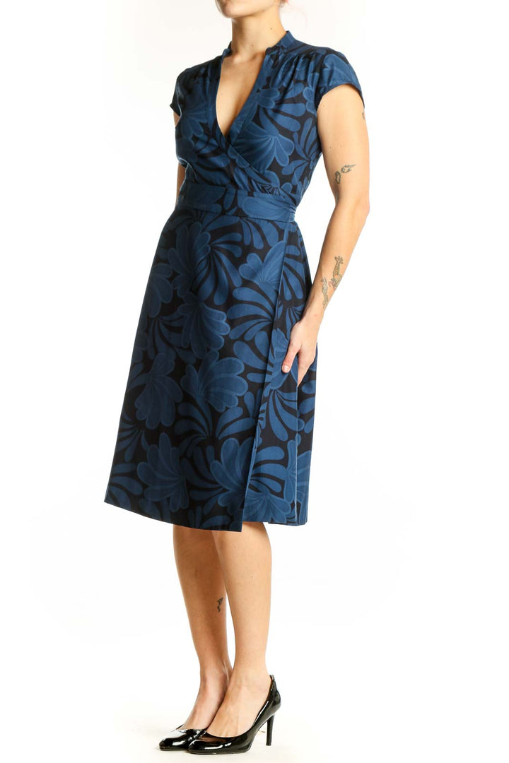 Navy floral wrap midi dress with cap sleeves and wrap-front design, front view