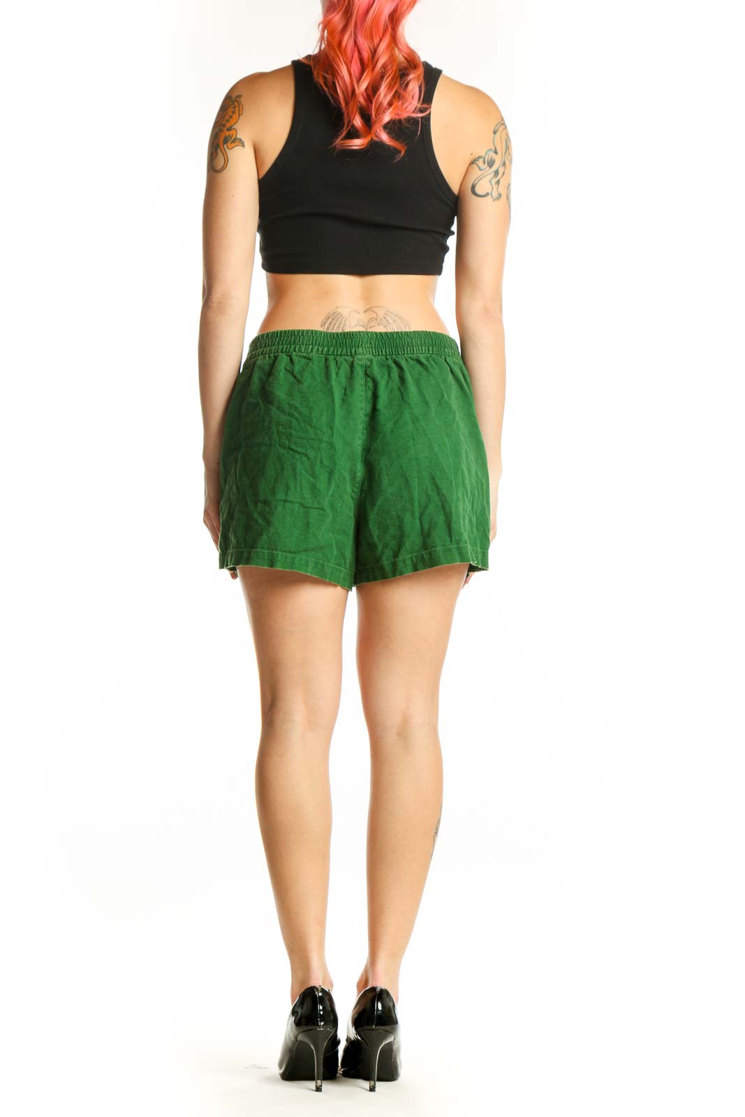 Back view of green linen viscose shorts showing relaxed fit and functional pocket design