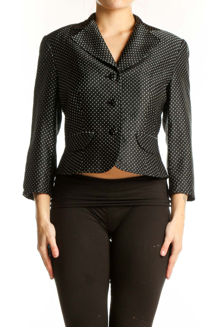 Black polka dot cropped blazer with white dots, button-front closure, and notch lapel collar
