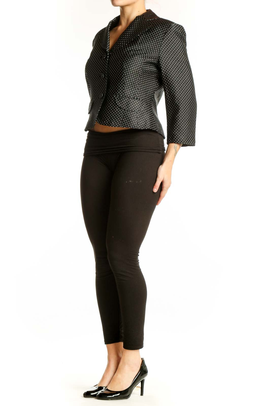 Black polka dot cropped blazer with white dots, button-front closure, and notch lapel collar