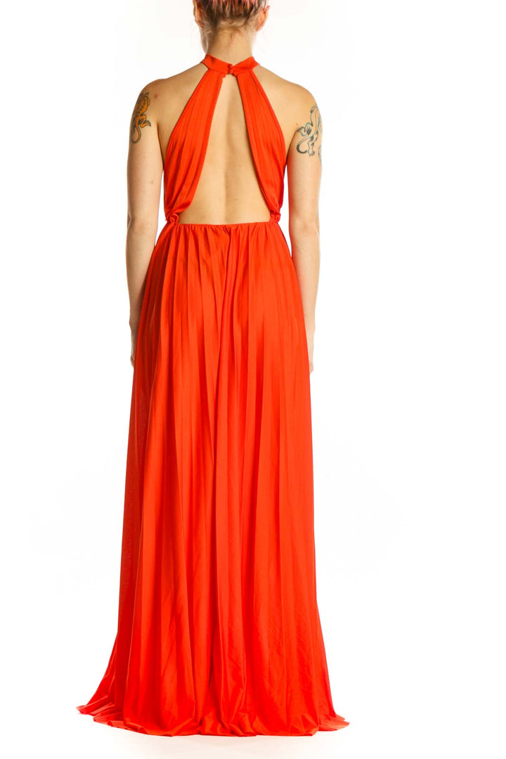 Red halter pleated maxi dress with open back design, rear view