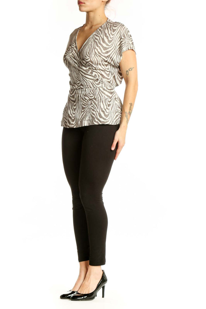 Cream and taupe zebra print linen wrap top by Banana Republic, front view showing wrap-front design and short sleeves