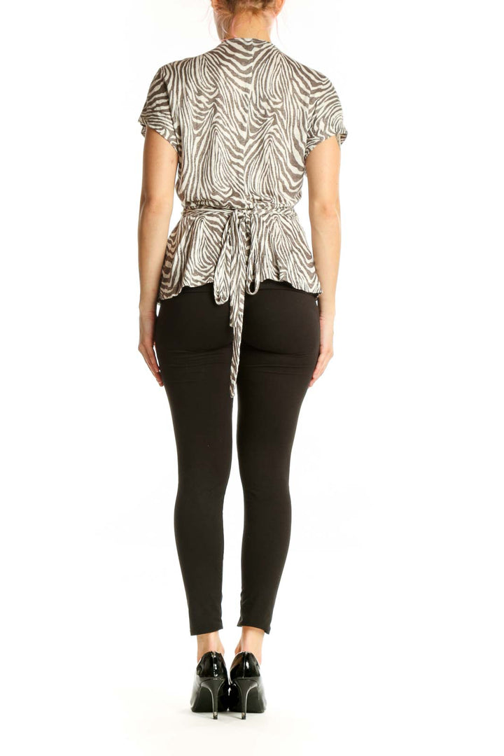 Cream and taupe zebra print linen wrap top by Banana Republic, back view displaying the wrap silhouette and fit