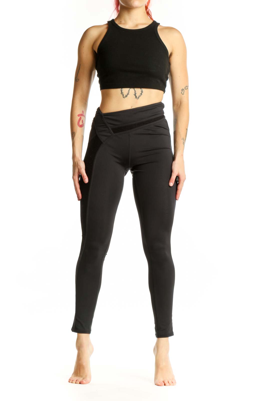 Black wrap waist activewear leggings front view, XS size, showing high-waisted design and cropped length