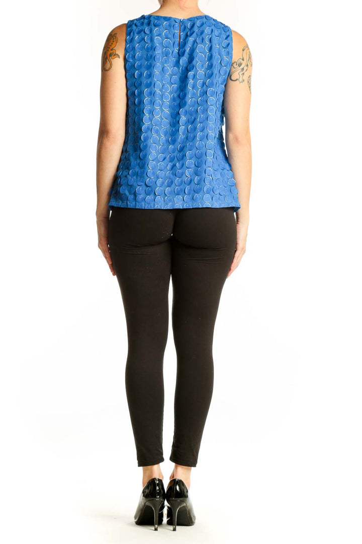 Blue textured sleeveless tank top with dimensional circle pattern, back view