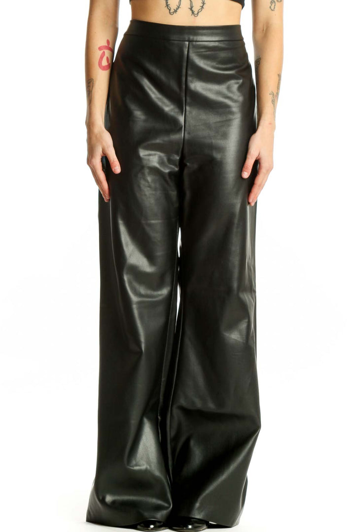 Black PU leather wide leg pants with high waist, front view on model