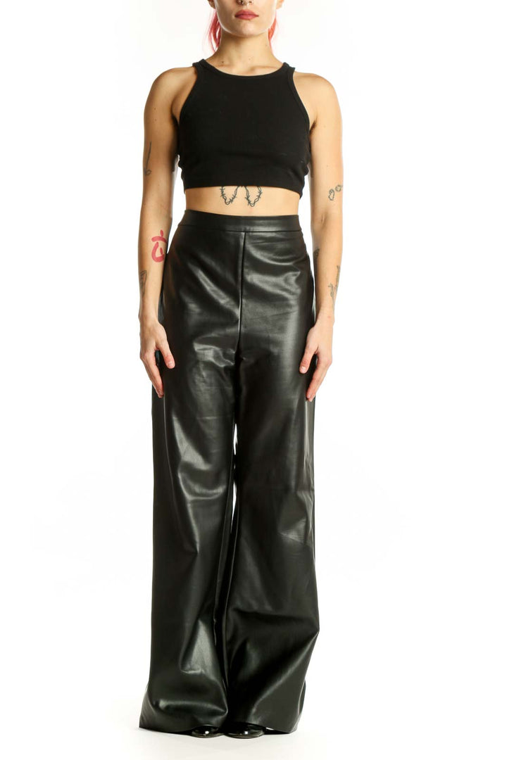Black PU leather wide leg pants with high waist, front view on model