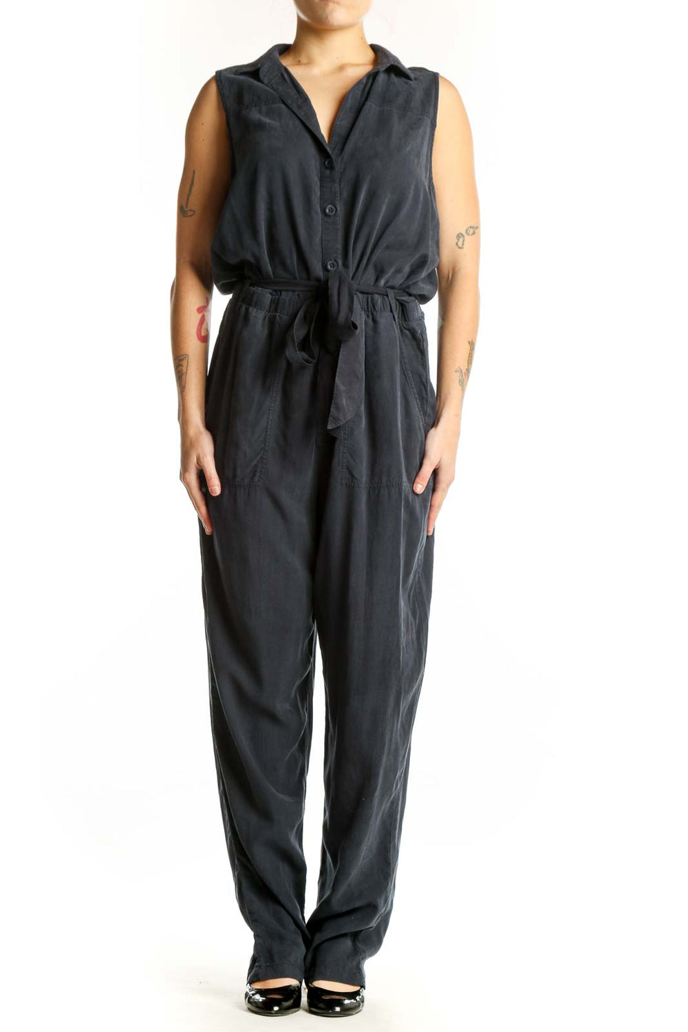 Black sleeveless Tencel jumpsuit with button-front and tie-waist belt, front view