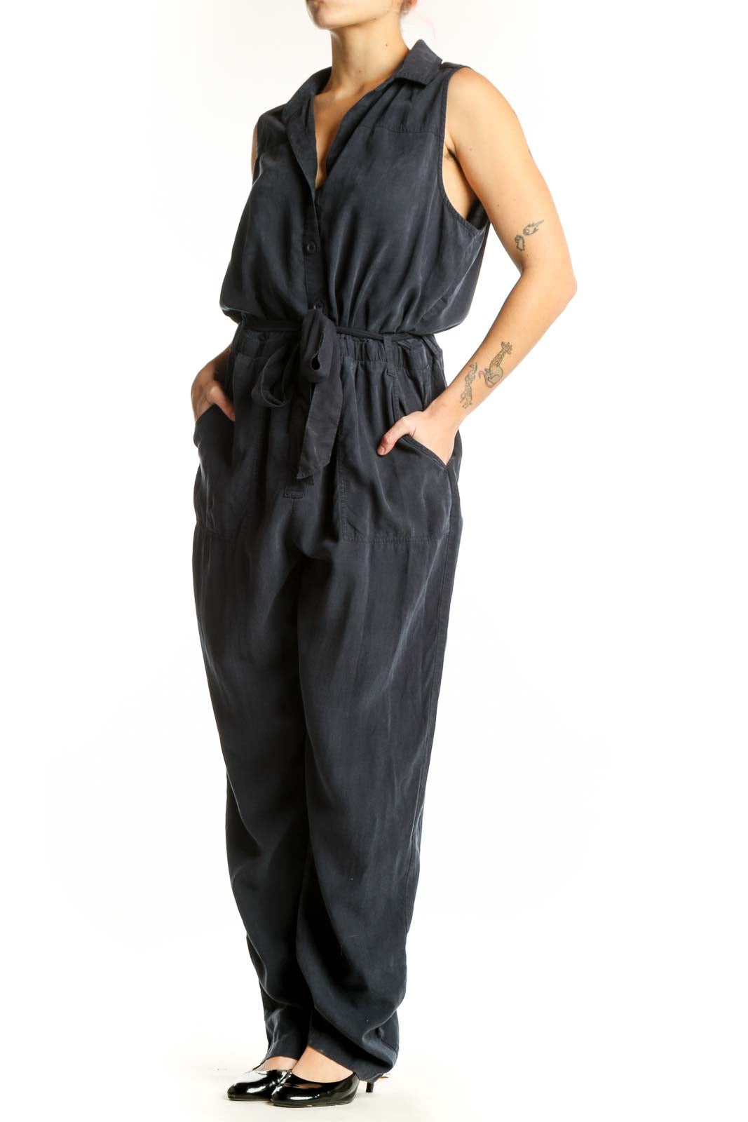 Black sleeveless Tencel jumpsuit with button-front and tie-waist belt, front view