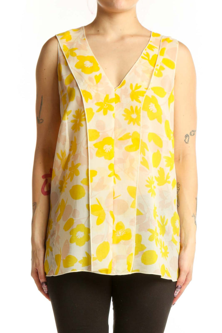 Yellow and cream floral print sleeveless tank top with V-neckline, front view