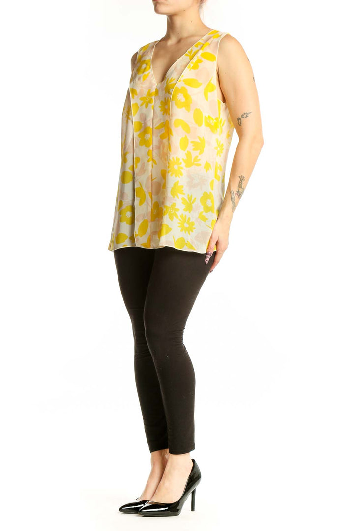 Yellow and cream floral print sleeveless tank top with V-neckline, front view