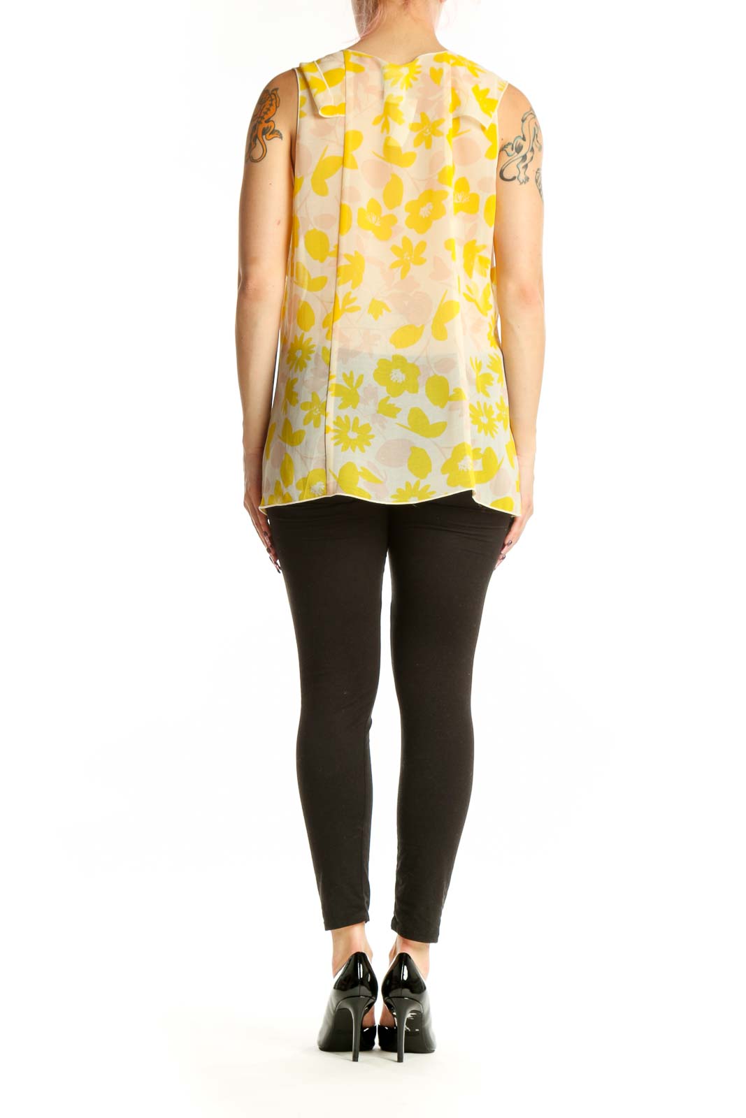Yellow and cream floral print sleeveless tank top, back view showing relaxed fit