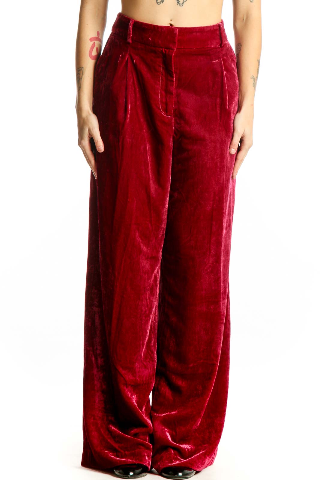 Red velvet wide-leg pants with high waist and pleated front detail, displayed on model