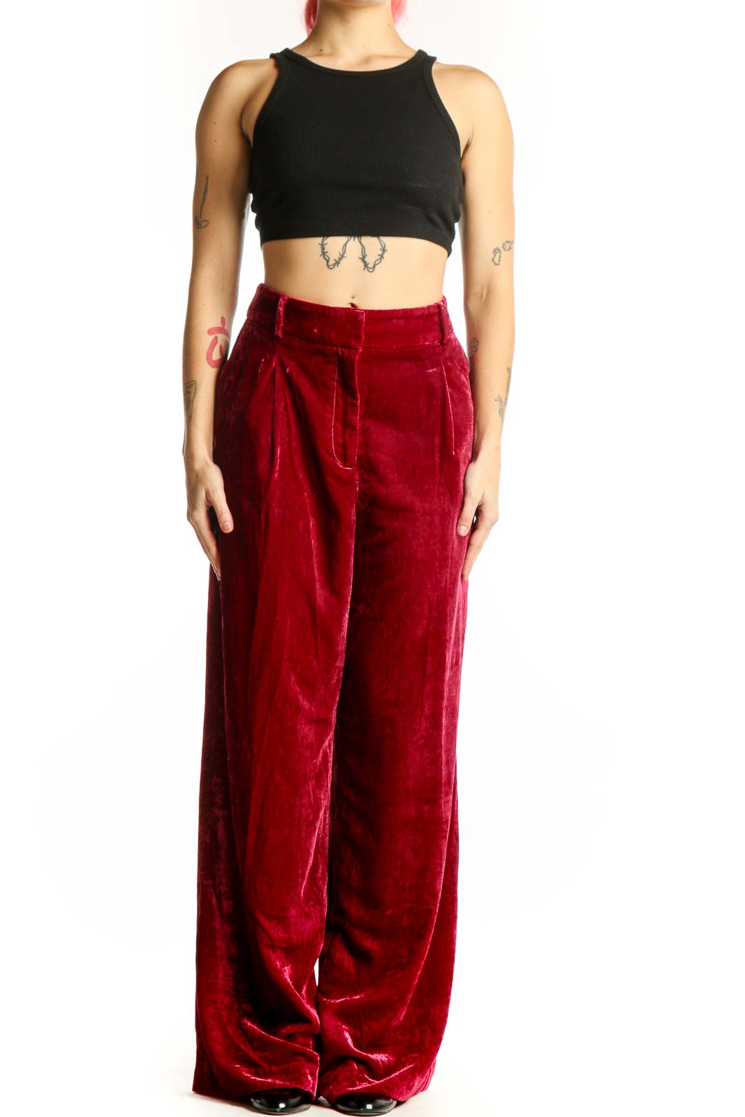 Red velvet wide-leg pants with high waist and pleated front detail, displayed on model