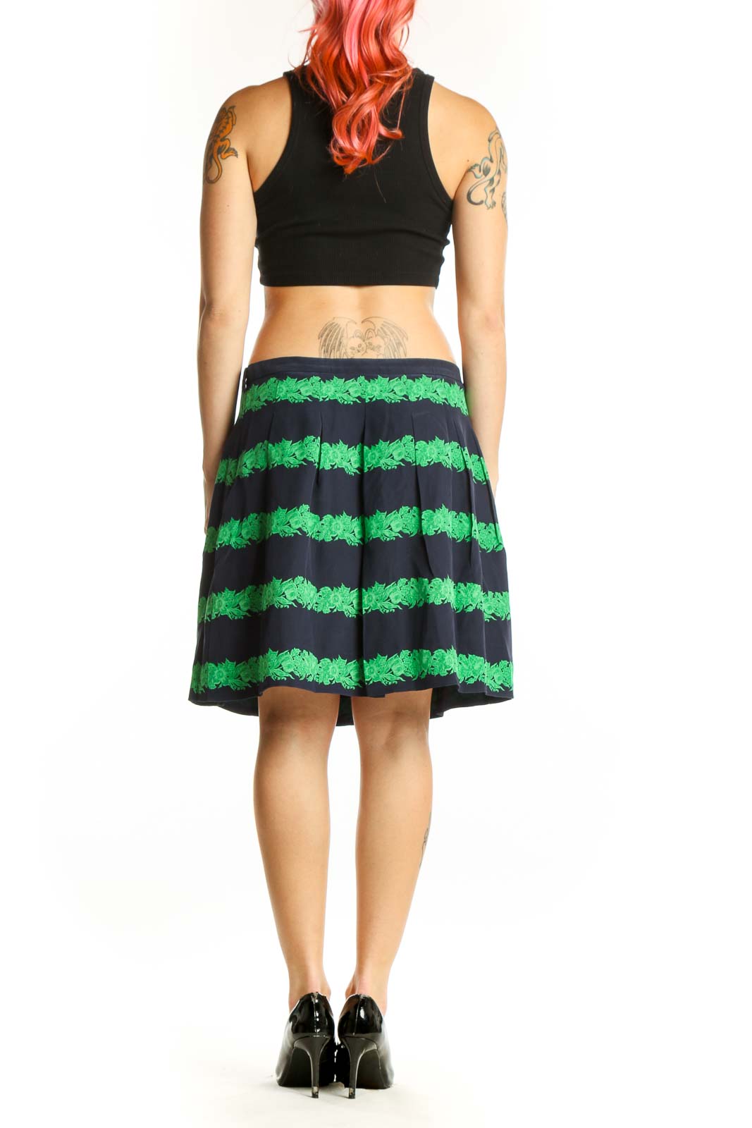 Back view of green and black striped pleated knee-length skirt by J.Crew showing pleated construction