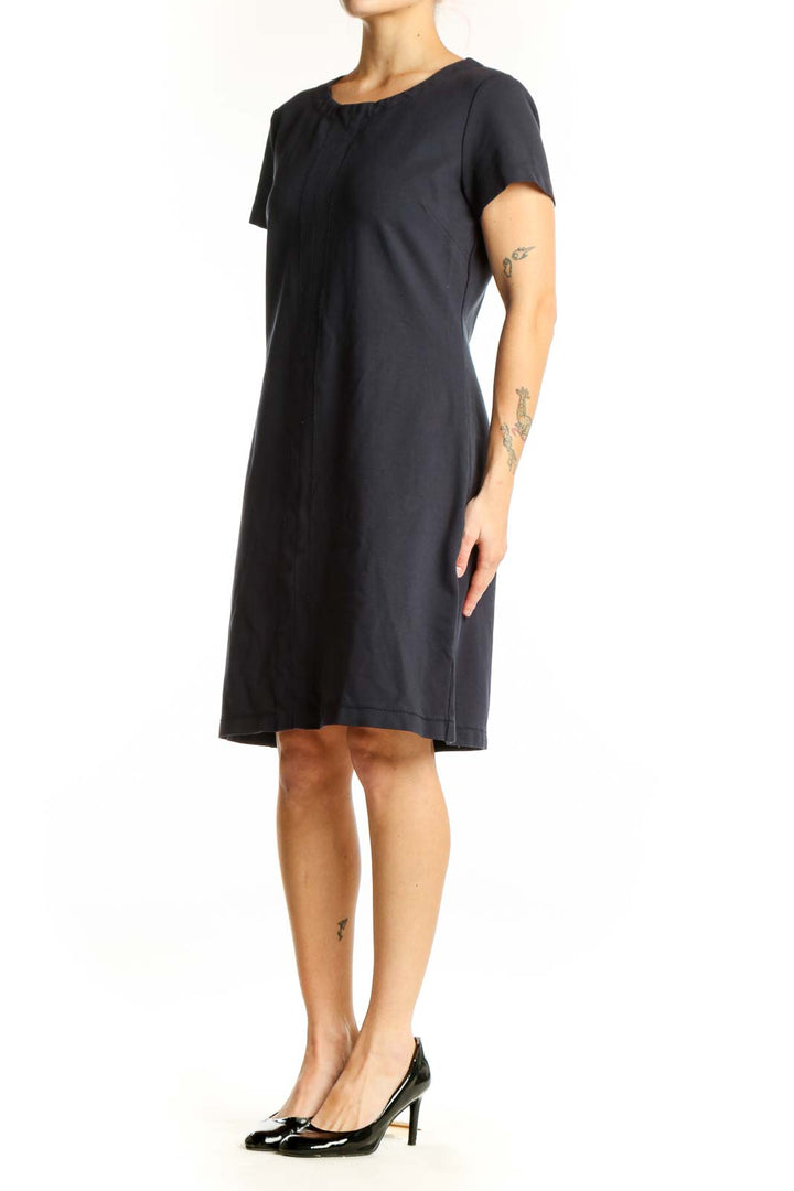 Black short sleeve t-shirt dress with center pleat detail and crew neckline, front view