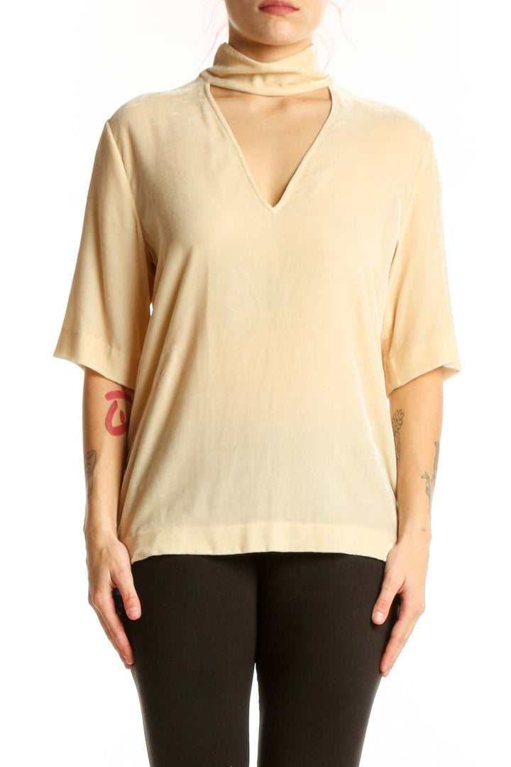 Cream choker neck rayon silk top by Theory with cutout detail, front view on model