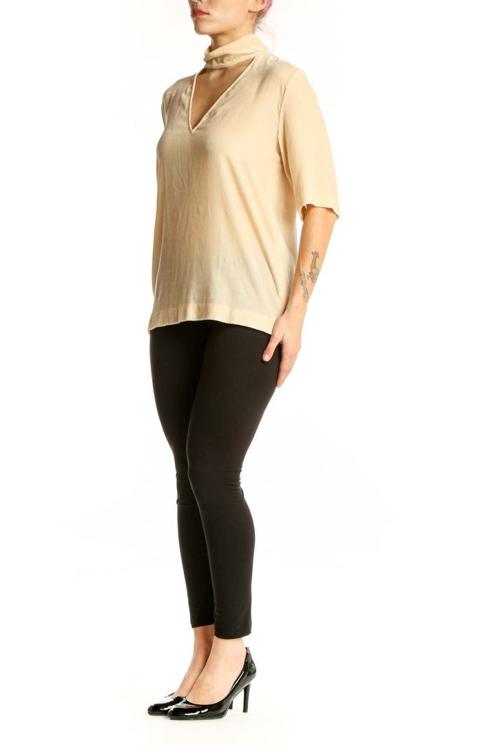 Cream choker neck rayon silk top by Theory with cutout detail, front view on model