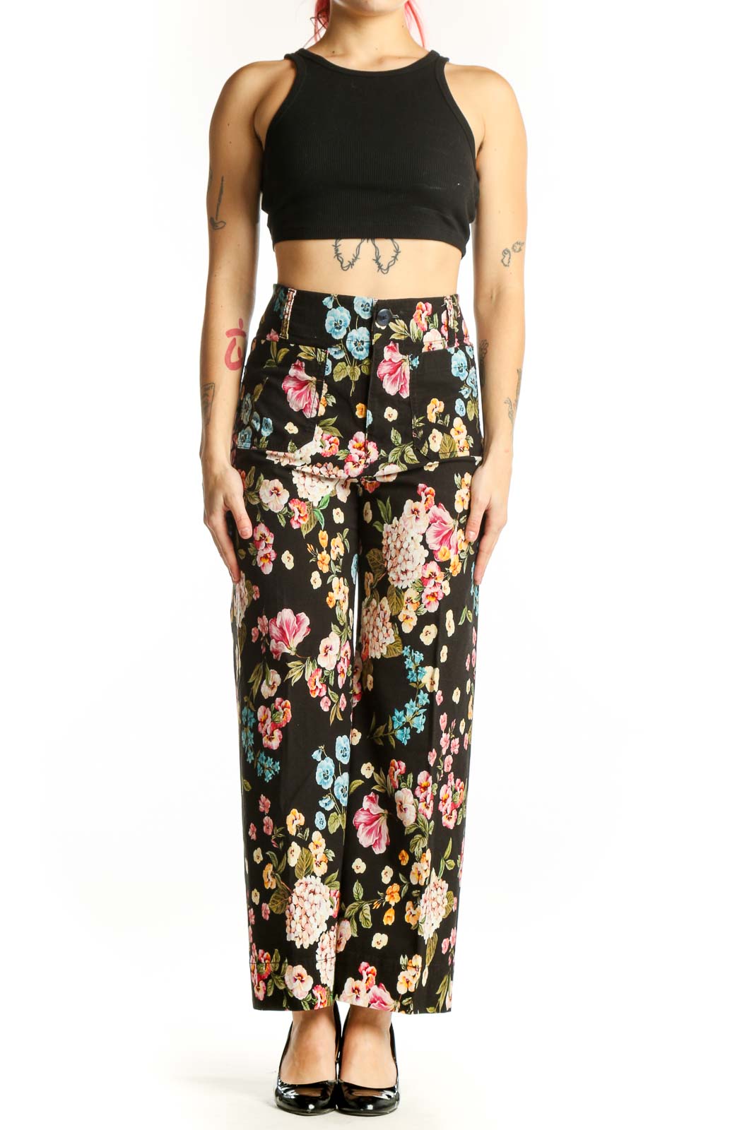 Black floral wide-leg pants with multicolor botanical print, high-waisted fit, front view