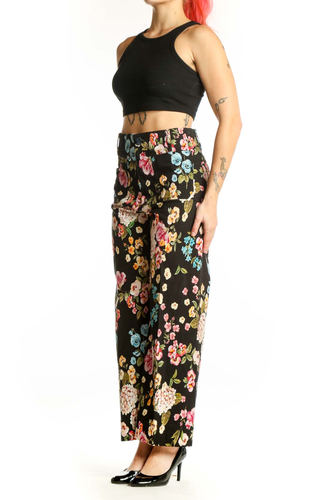 Black floral wide-leg pants with multicolor botanical print, high-waisted fit, front view