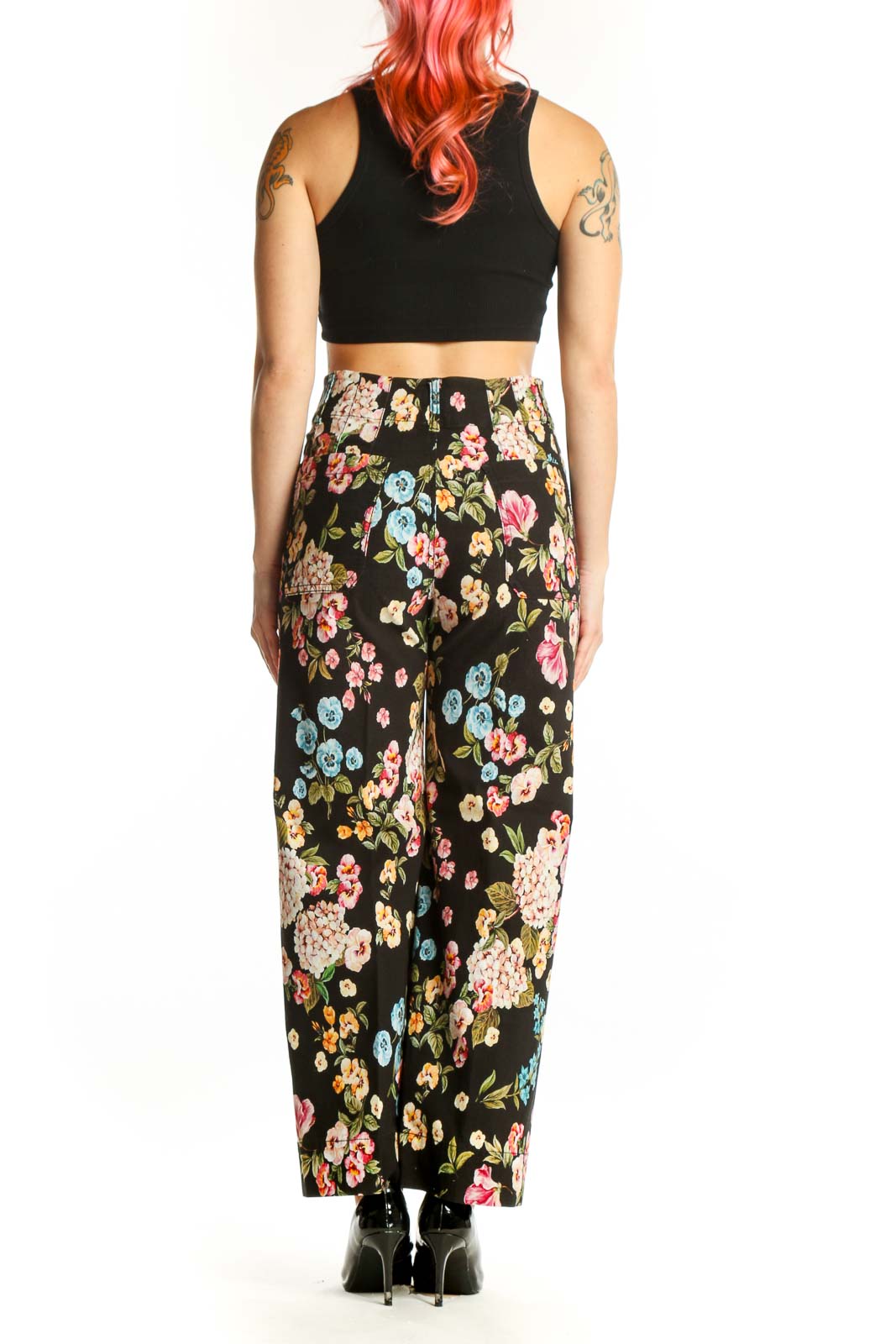 Black floral wide-leg pants with multicolor botanical print, high-waisted fit, back view