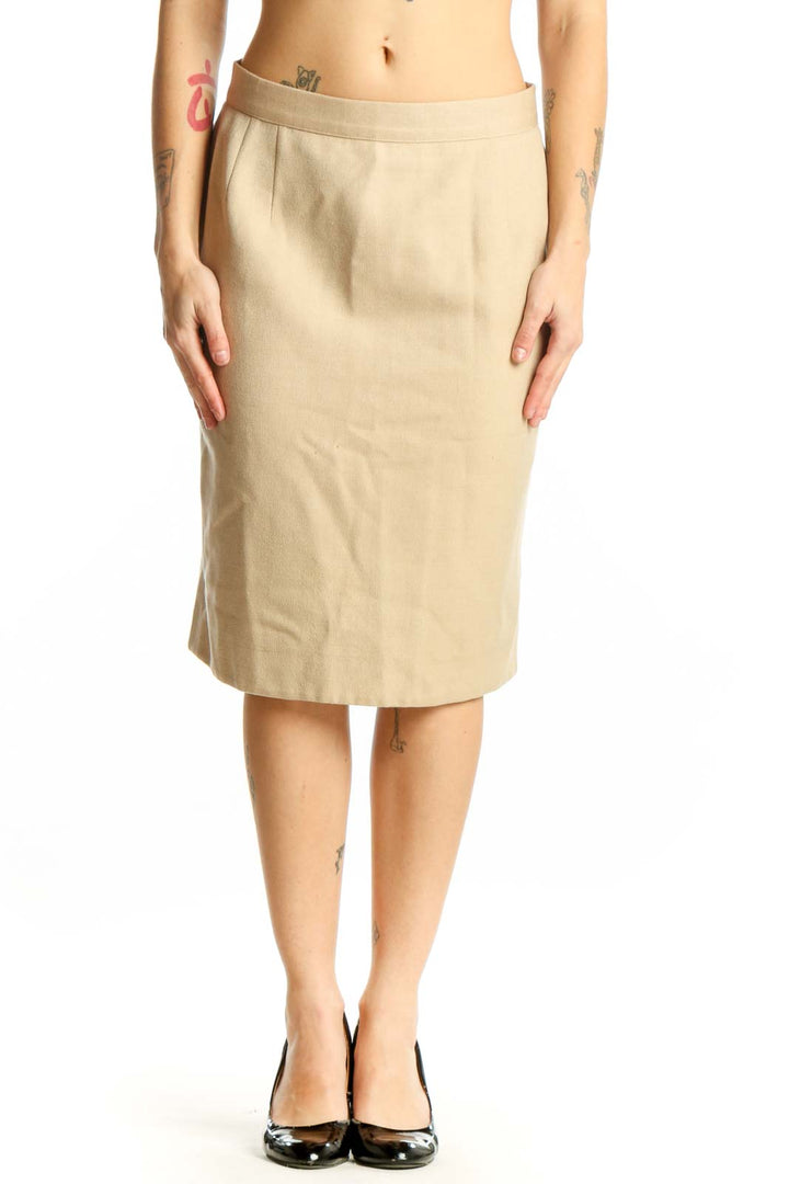 Cream wool pencil skirt by Valentino, front view, showing straight silhouette and knee-length cut on model