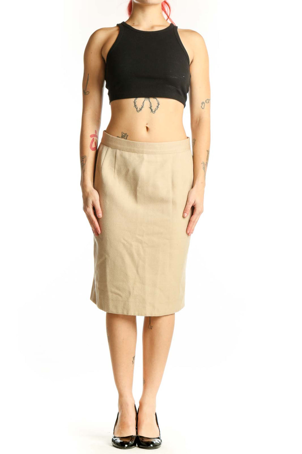 Cream wool pencil skirt by Valentino, front view, showing straight silhouette and knee-length cut on model