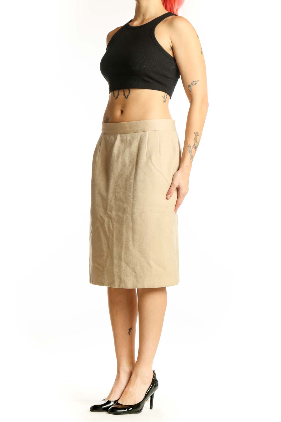Cream wool pencil skirt by Valentino, front view, showing straight silhouette and knee-length cut on model