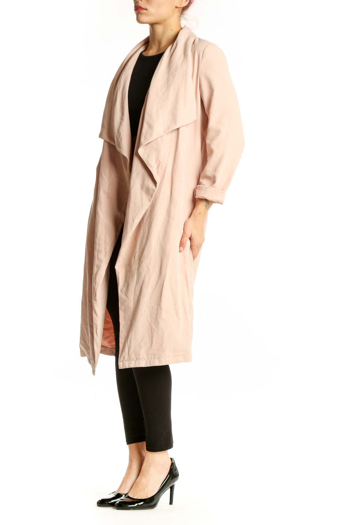Front view of cream draped long cardigan jacket with open front and three-quarter sleeves