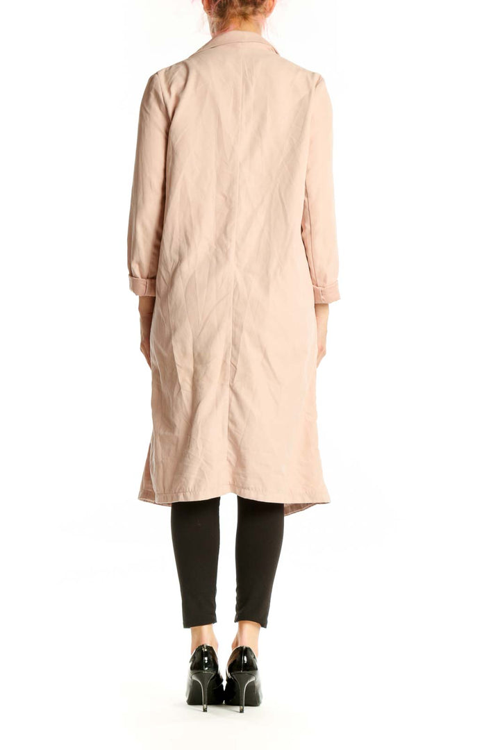 Back view of cream draped long cardigan jacket showing flowing silhouette and length