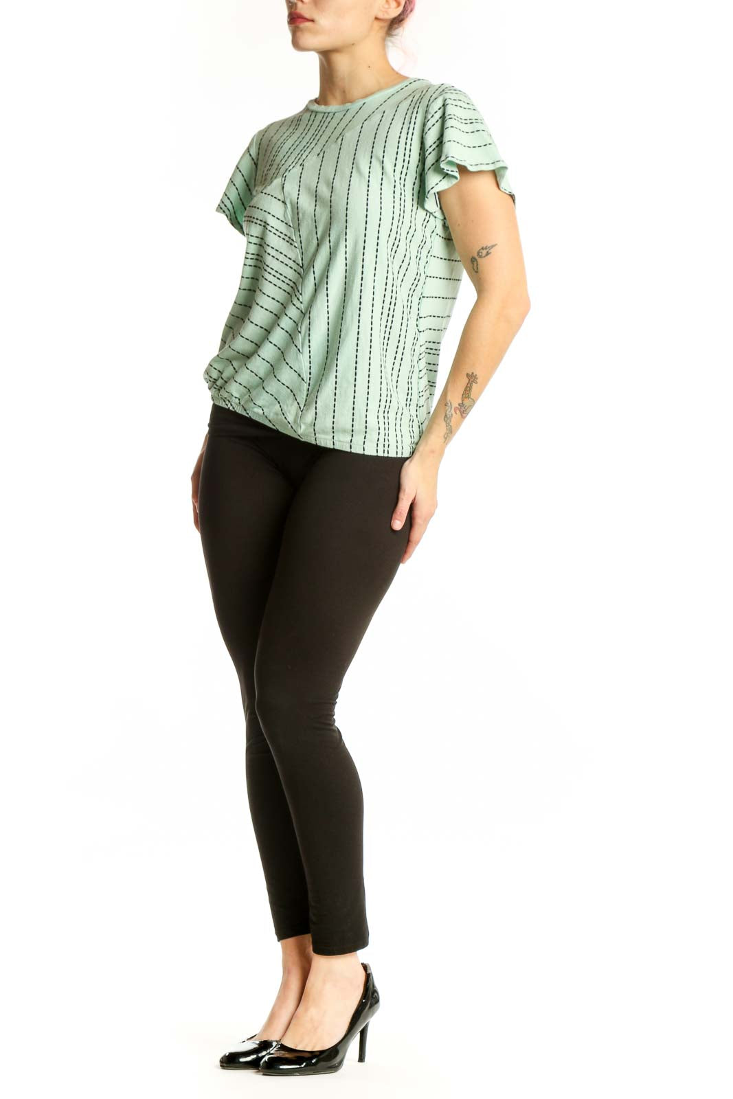 Sage green geometric print short-sleeve top by Dolan, front view showing linear pattern and crew neckline