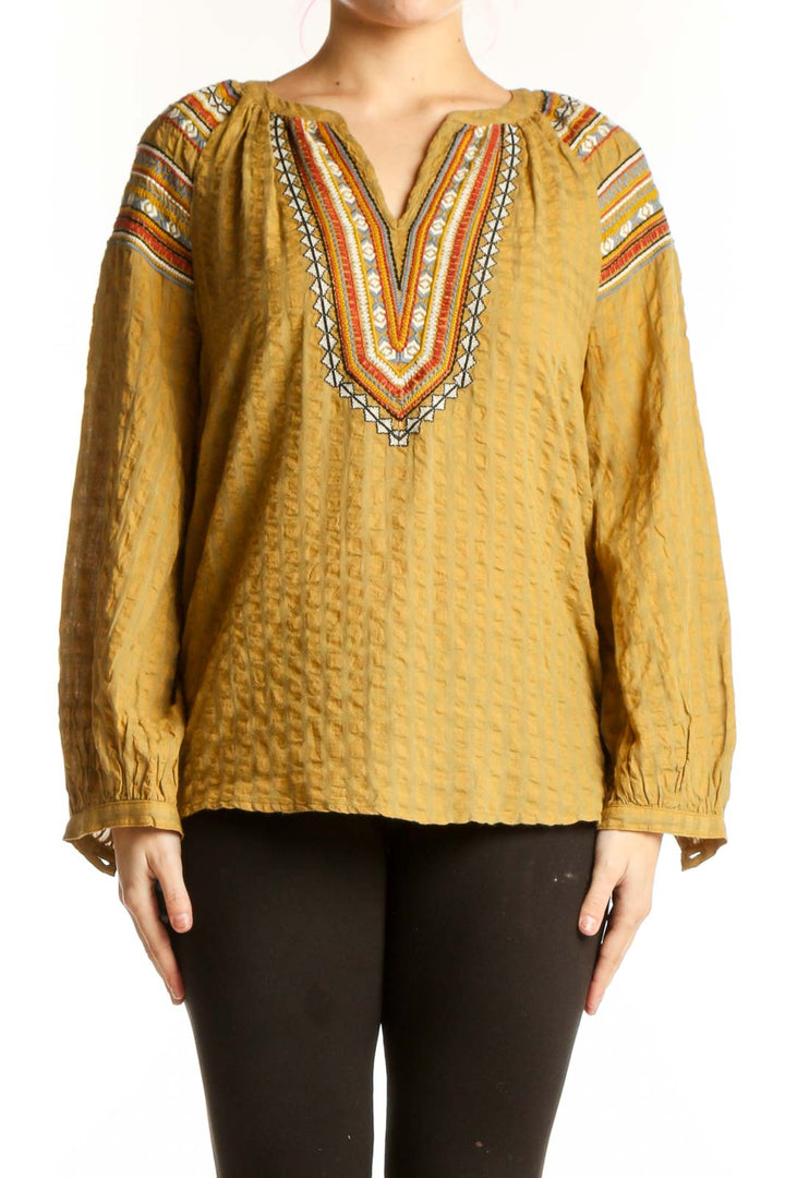 Rachel Zoe gold embroidered boho tunic top with vibrant red and orange neckline detailing, front view on model