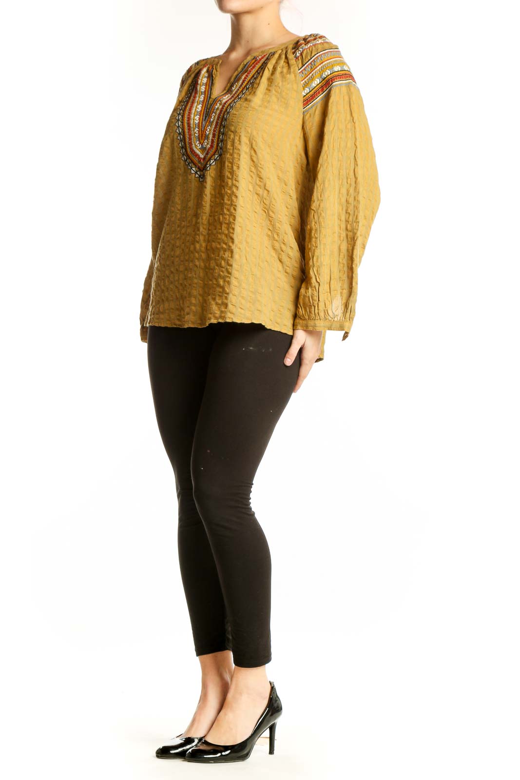 Rachel Zoe gold embroidered boho tunic top with vibrant red and orange neckline detailing, front view on model