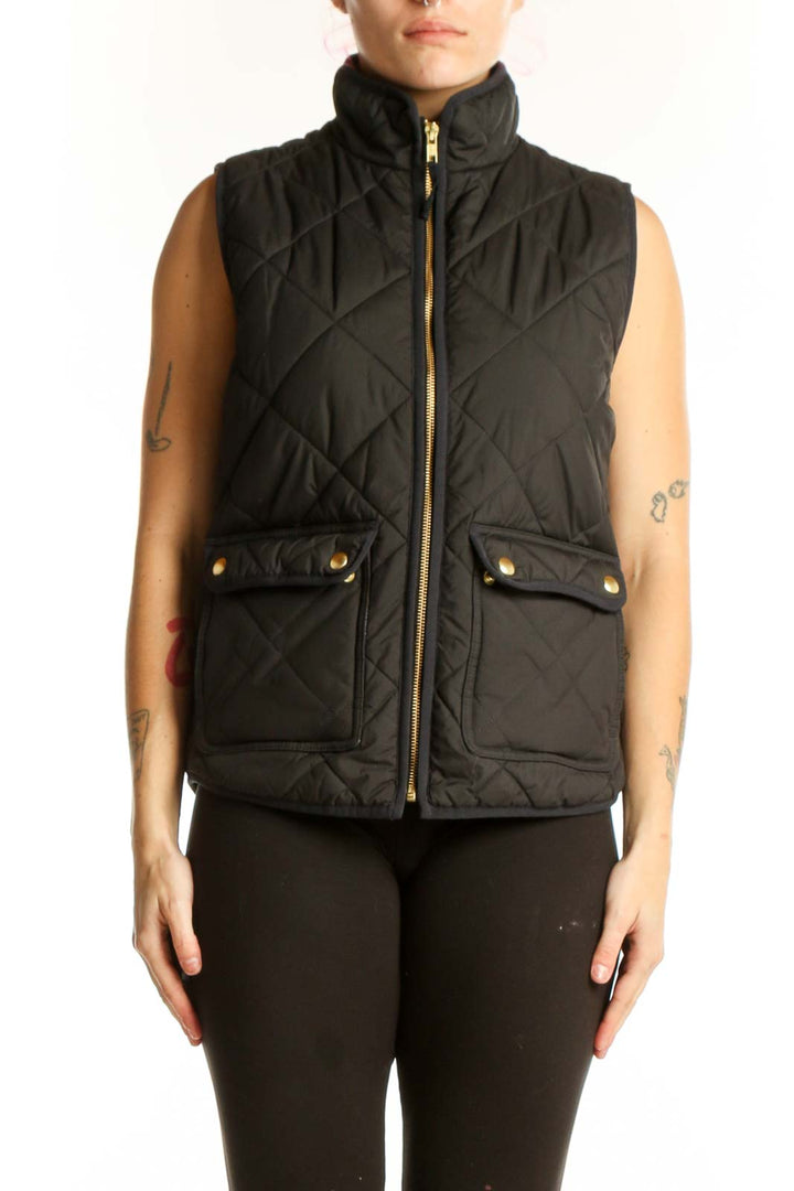 Black quilted puffer vest by J.Crew with diamond quilting pattern, gold-tone zipper, and functional front pockets