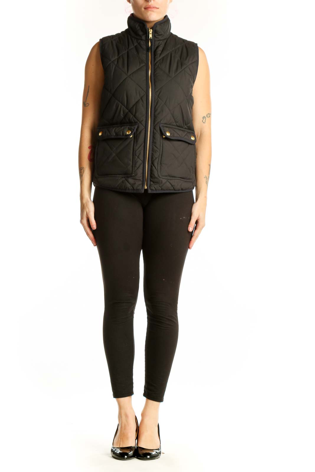 Black quilted puffer vest by J.Crew with diamond quilting pattern, gold-tone zipper, and functional front pockets