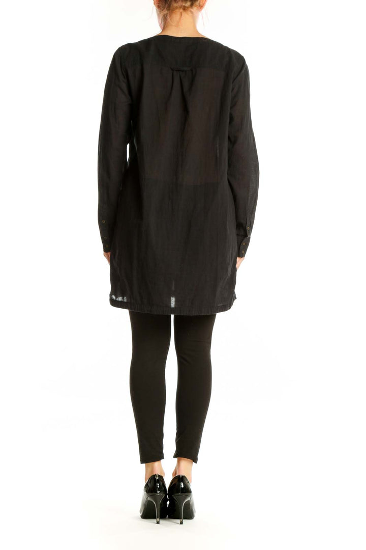 Black cotton button-front shirt dress by Joie, back view showing relaxed fit and midi length