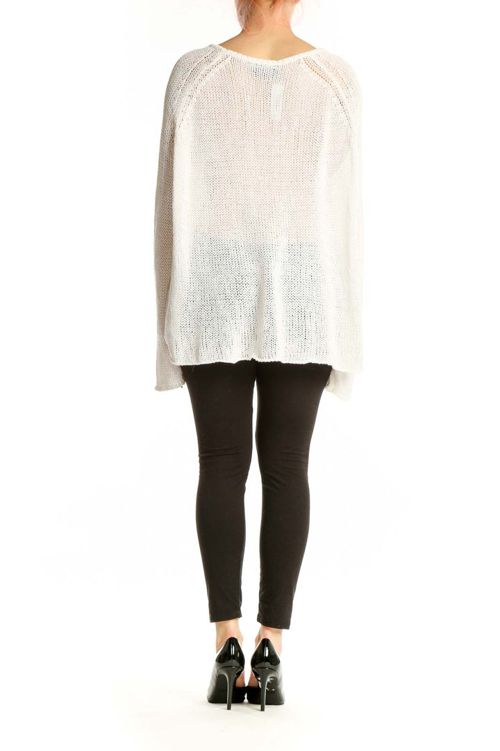 Back view of cream anchor sweater showing navy anchor motif, relaxed fit silhouette