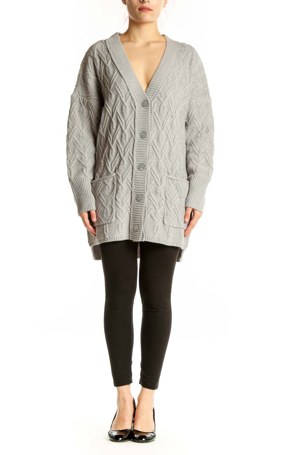 Cream cable knit cardigan with button-front closure and V-neckline, front view