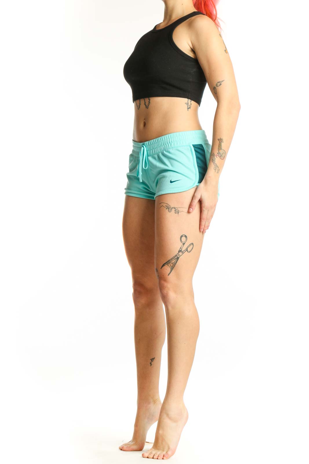 Front view of turquoise Nike athletic shorts with adjustable drawstring and Nike Swoosh logo