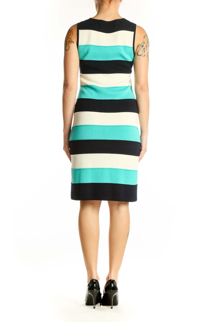 Back view of turquoise, black, and cream striped Milly knit dress showing sleeveless design and fitted silhouette