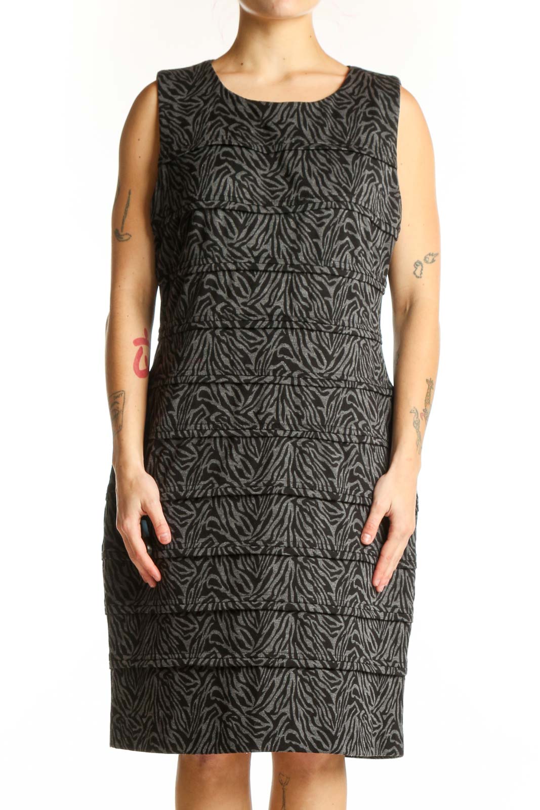Black zebra print sleeveless shift dress by Calvin Klein, front view on model