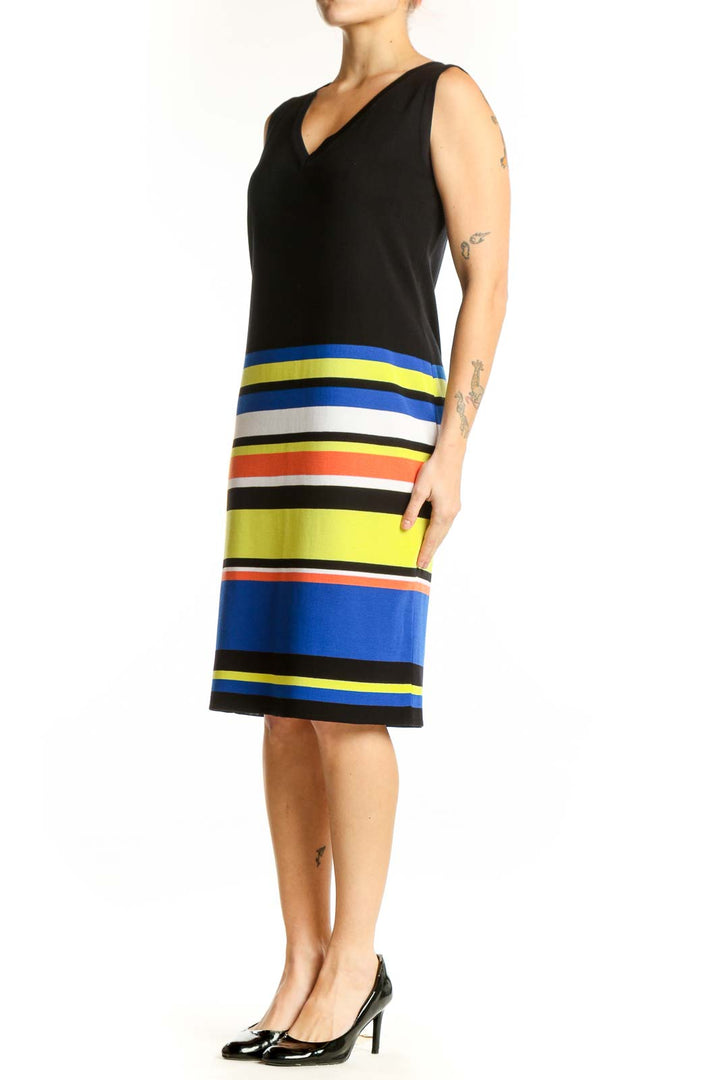 Black sleeveless dress with vibrant colorblock horizontal stripes in blue, yellow, orange, and white by Misook, front view