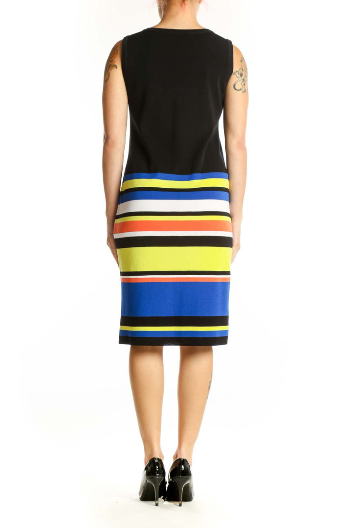 Black sleeveless dress with colorblock striped pattern, back view showing V-neckline and knee-length cut