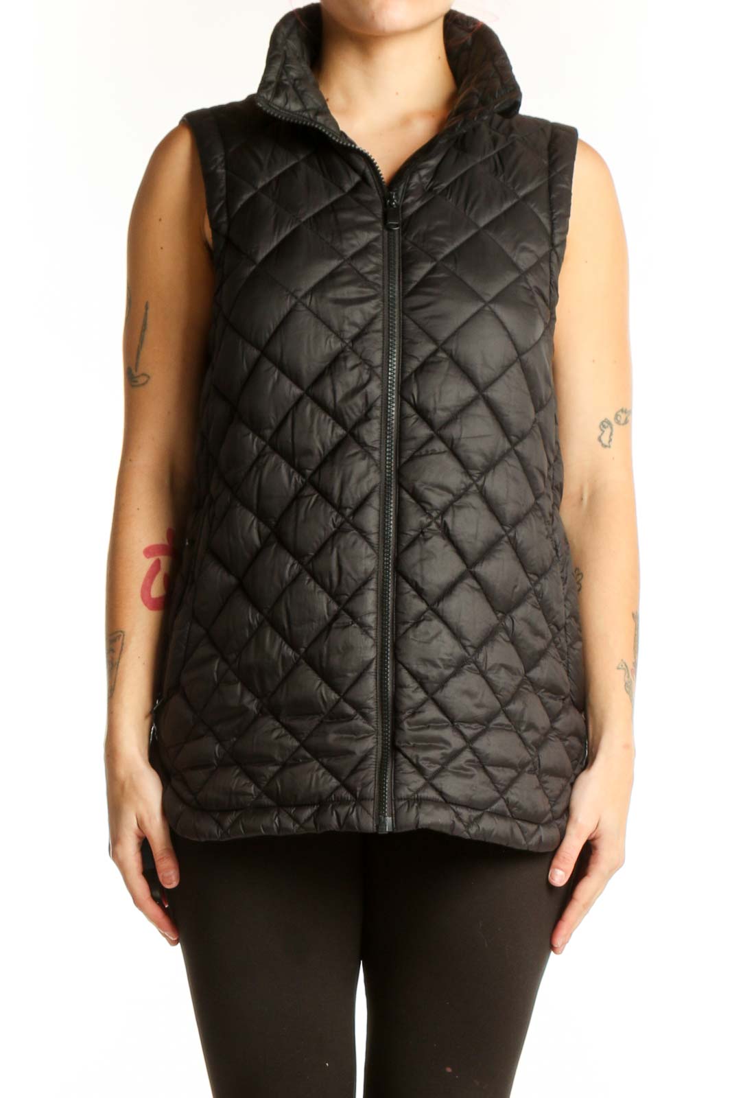 Black quilted puffer vest with diamond quilting pattern and full-length zip closure, front view