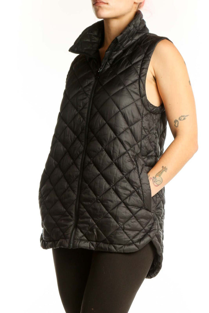 Black quilted puffer vest with diamond quilting pattern and full-length zip closure, front view