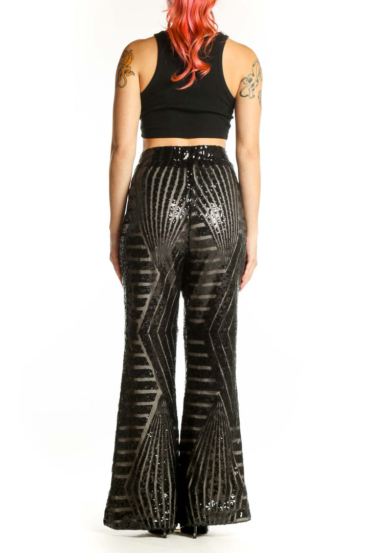 Black sequin striped wide leg pants with geometric pattern, back view