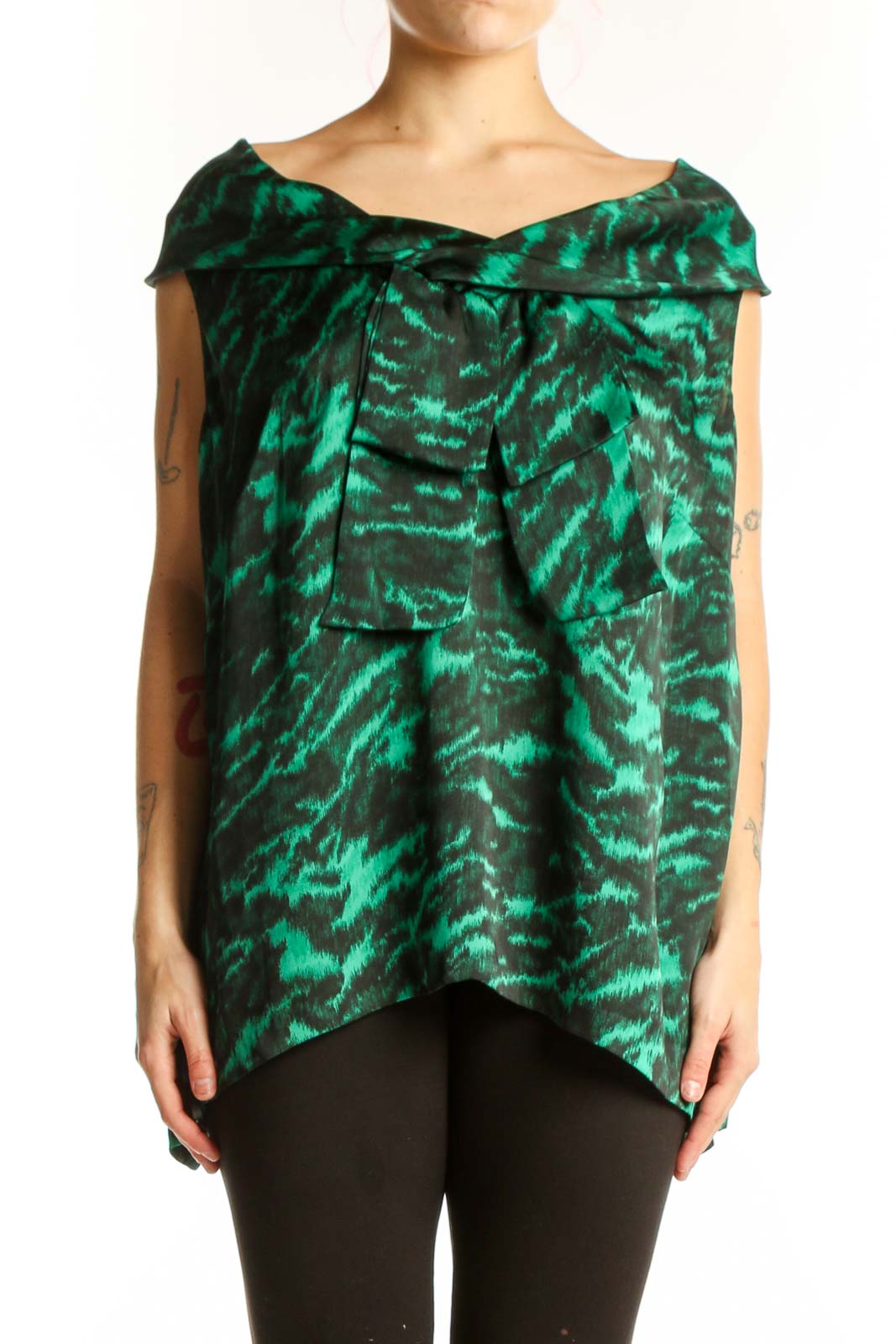 Green and black animal print off-shoulder top with draped neckline and asymmetrical hem, front view