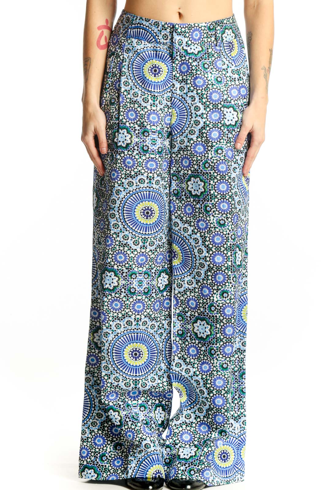 Front view of blue geometric floral wide-leg linen pants with sunburst and circular motifs