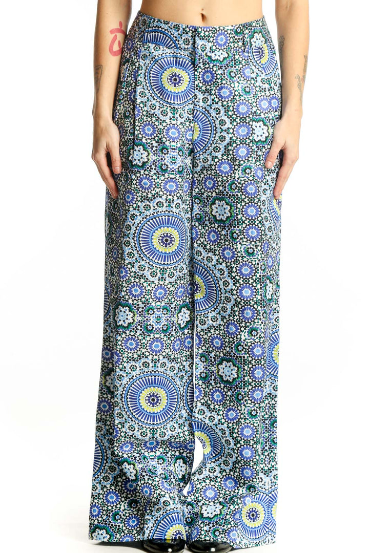 Front view of blue geometric floral wide-leg linen pants with sunburst and circular motifs