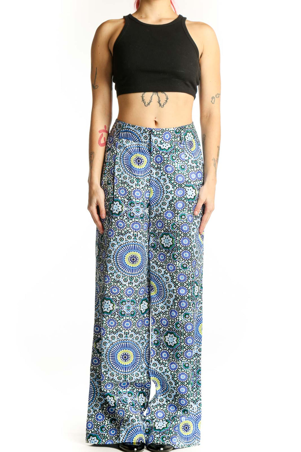 Front view of blue geometric floral wide-leg linen pants with sunburst and circular motifs